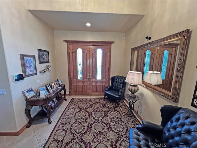 entryway featuring light tile patterned floors