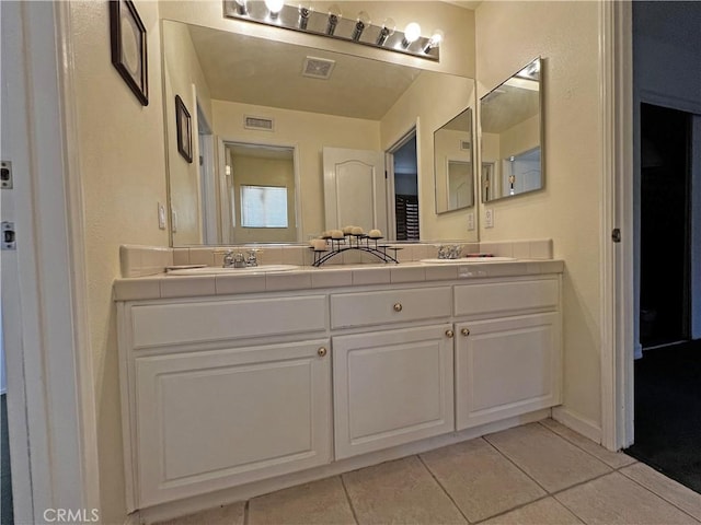 bathroom featuring vanity and tile patterned flooring