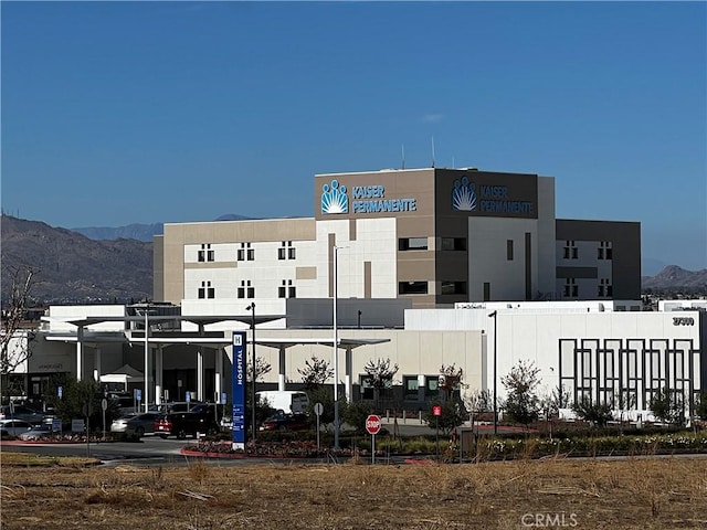 view of building exterior with a mountain view