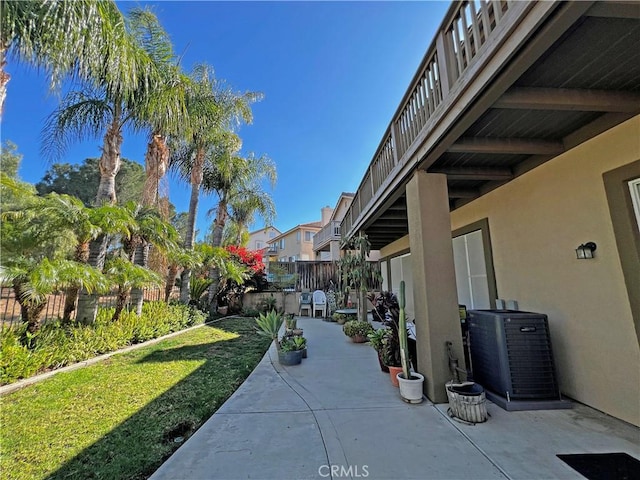 view of home's community featuring a yard and a patio