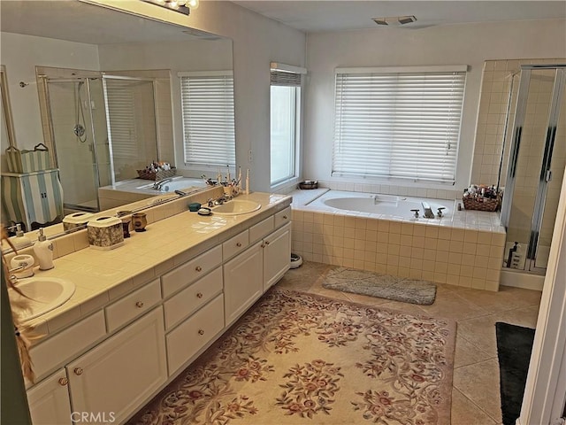 bathroom featuring vanity, tile patterned floors, and shower with separate bathtub