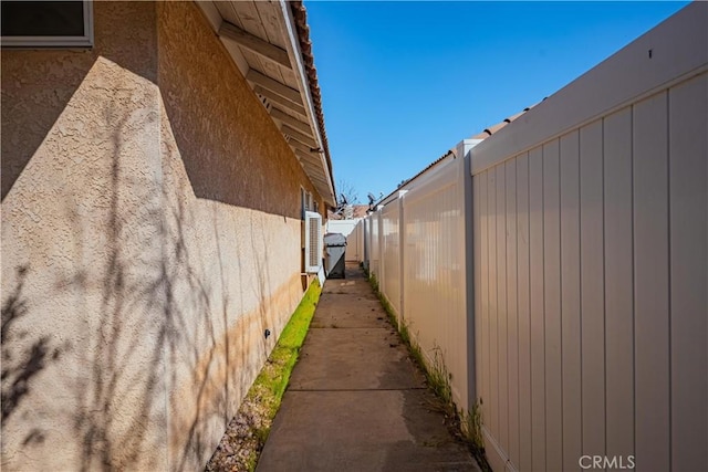 view of home's exterior featuring fence and stucco siding