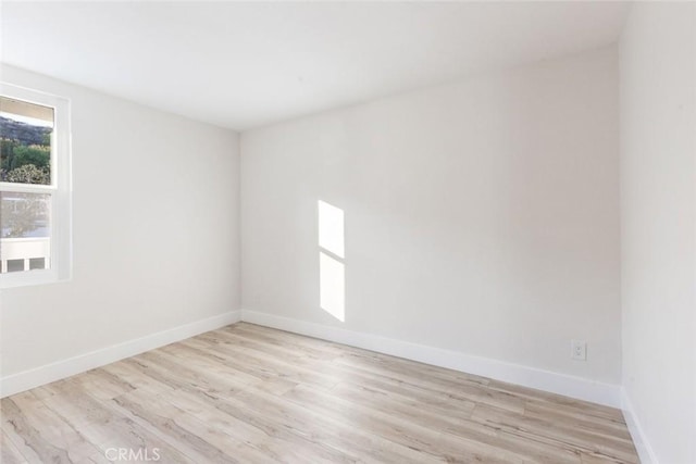 unfurnished room featuring light wood-type flooring