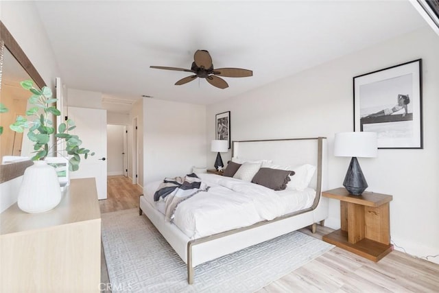 bedroom with ceiling fan and light hardwood / wood-style flooring