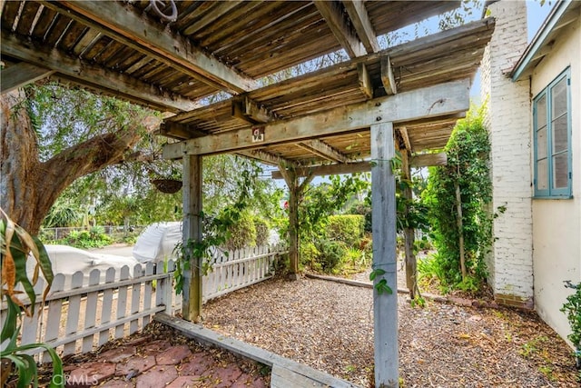 exterior space with a pergola and a patio