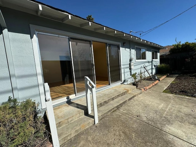 rear view of property featuring a patio area