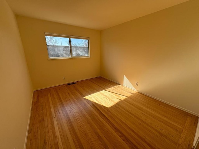 unfurnished room featuring light hardwood / wood-style floors