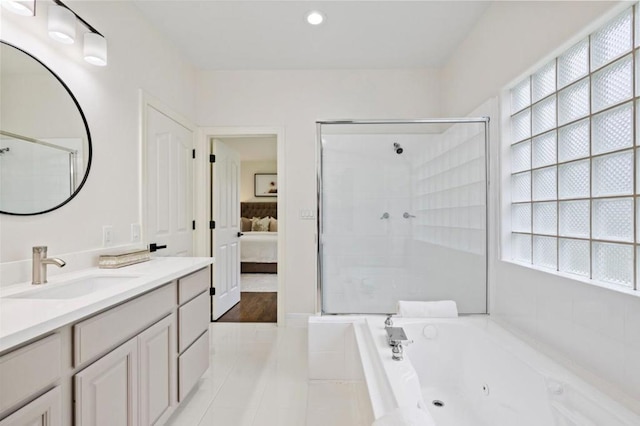 bathroom with vanity, separate shower and tub, and tile patterned flooring