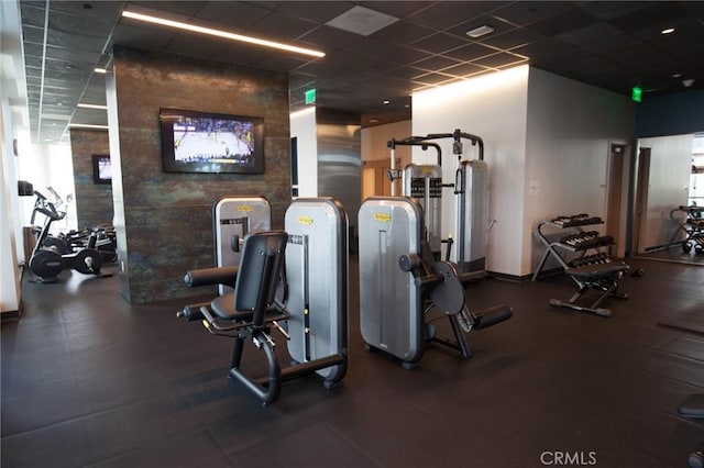 exercise room with a drop ceiling