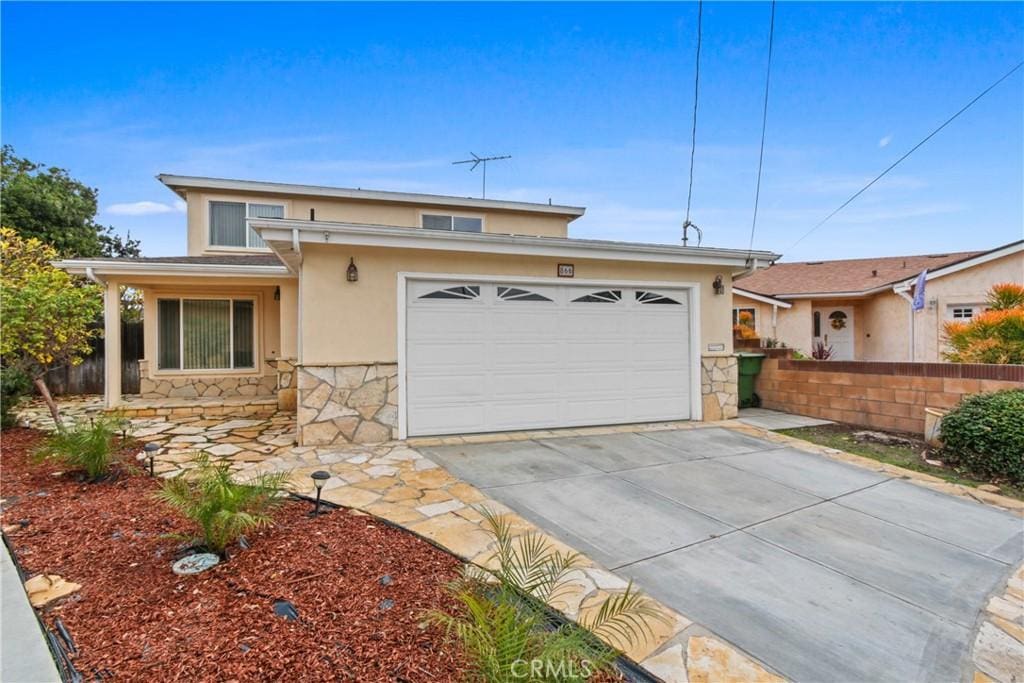 view of front of property with a garage