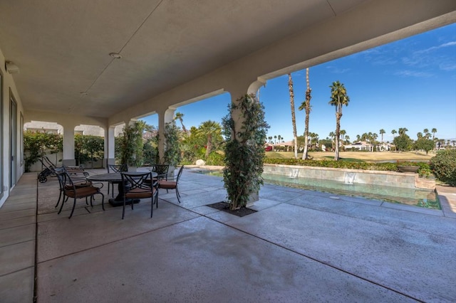 view of patio / terrace featuring pool water feature