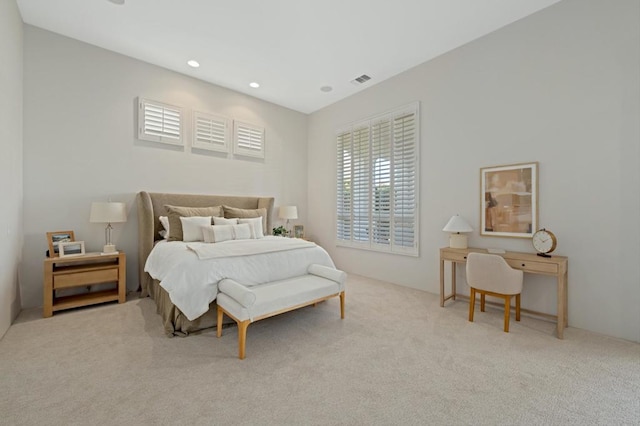 bedroom with light colored carpet