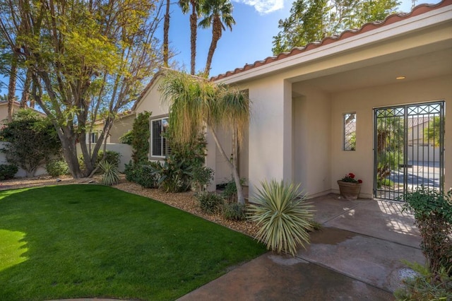 view of home's exterior featuring a yard