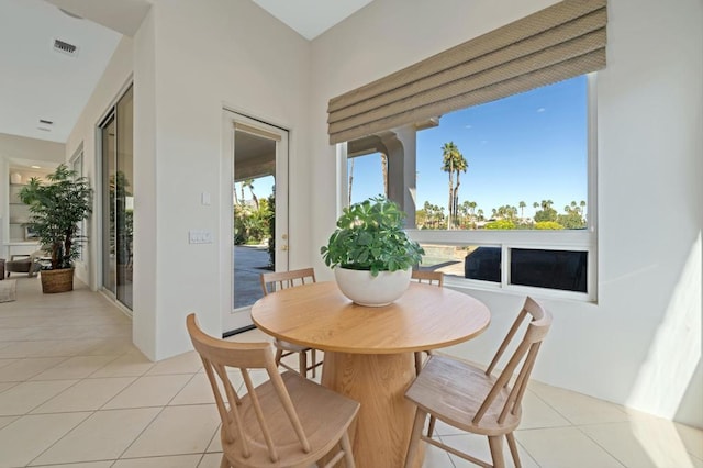 dining area featuring light tile patterned floors