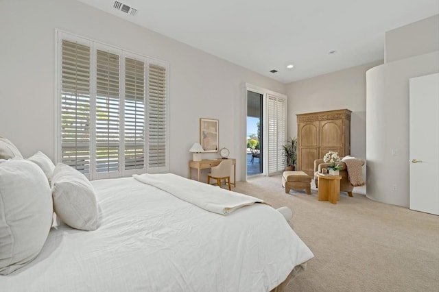 bedroom featuring light colored carpet and access to exterior