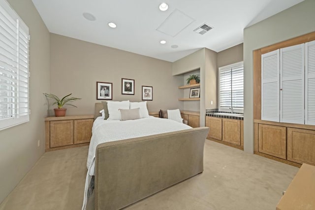 bedroom with light colored carpet