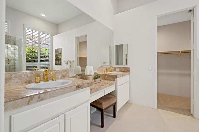 bathroom with vanity and tile patterned flooring