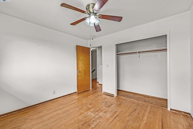 unfurnished bedroom with ceiling fan, a closet, and light hardwood / wood-style flooring