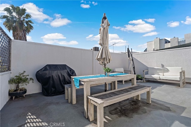 view of patio with a grill