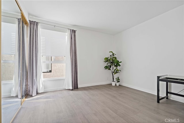 spare room featuring light hardwood / wood-style floors