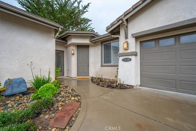 property entrance with a garage