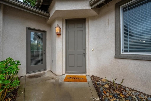 entrance to property with a patio area