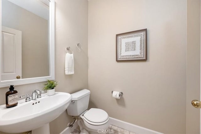 bathroom with sink, tile patterned floors, and toilet