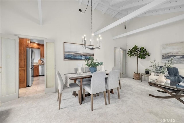 carpeted dining room featuring beamed ceiling, a chandelier, and high vaulted ceiling