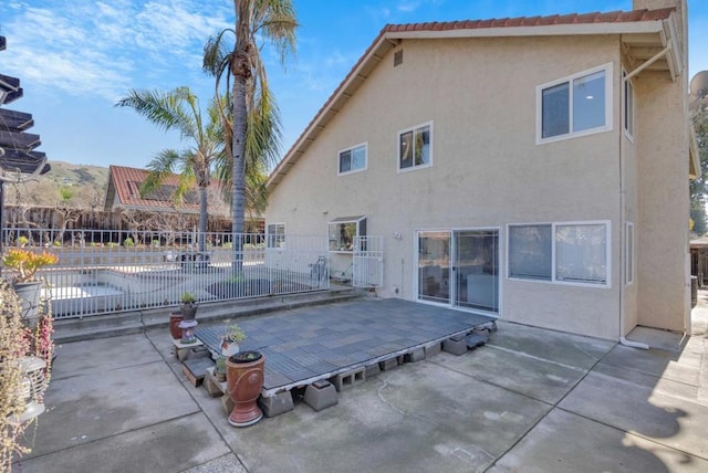 rear view of property featuring a patio area