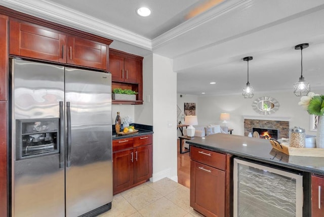 kitchen featuring pendant lighting, crown molding, wine cooler, a fireplace, and stainless steel fridge with ice dispenser