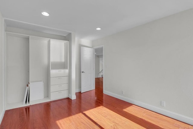 unfurnished bedroom featuring hardwood / wood-style flooring