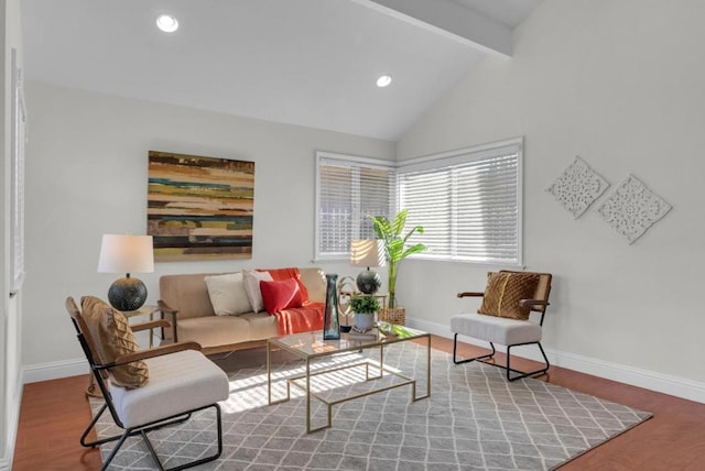 living room featuring lofted ceiling with beams and hardwood / wood-style floors