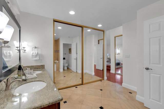 bathroom with vanity and toilet