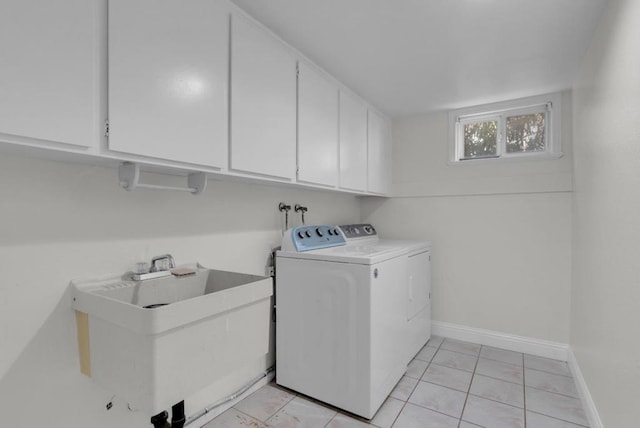 laundry area with cabinets, sink, and washer and dryer