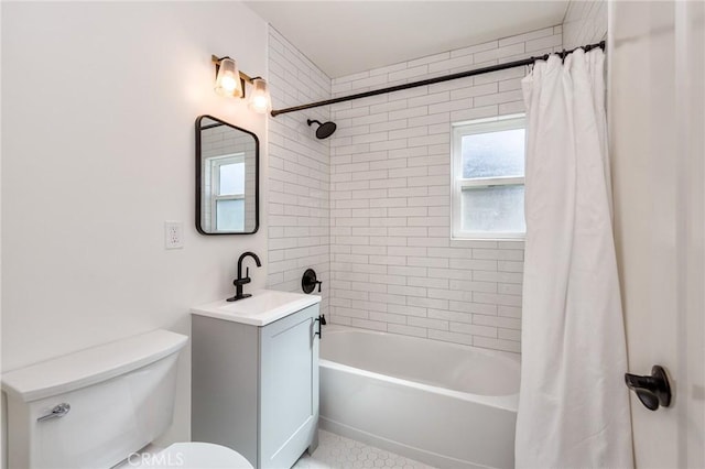 bathroom with shower / bath combo, vanity, and toilet