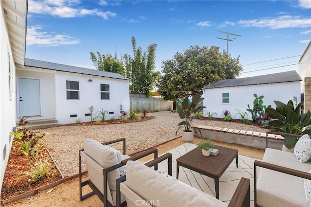 view of patio featuring fence and outdoor lounge area