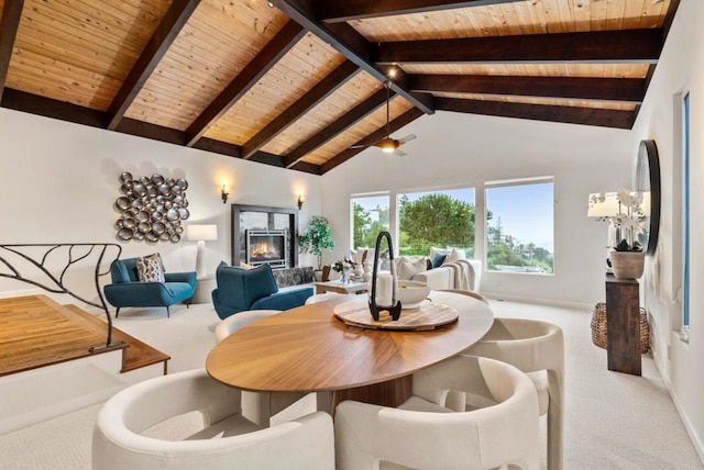 carpeted dining space with wood ceiling, beam ceiling, and high vaulted ceiling