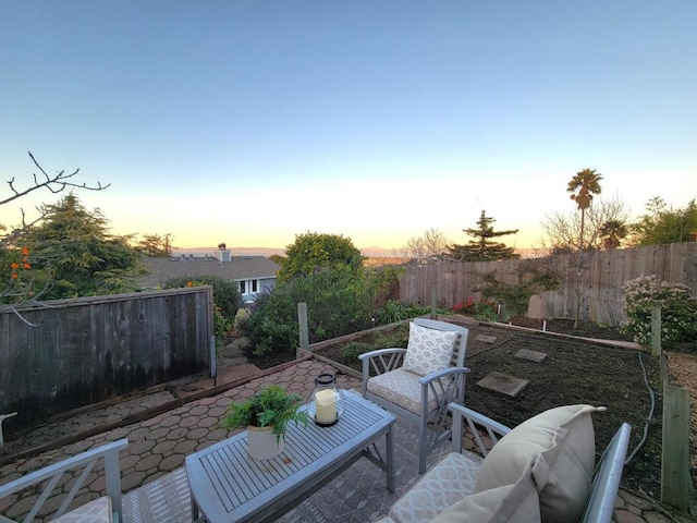 patio terrace at dusk with an outdoor living space