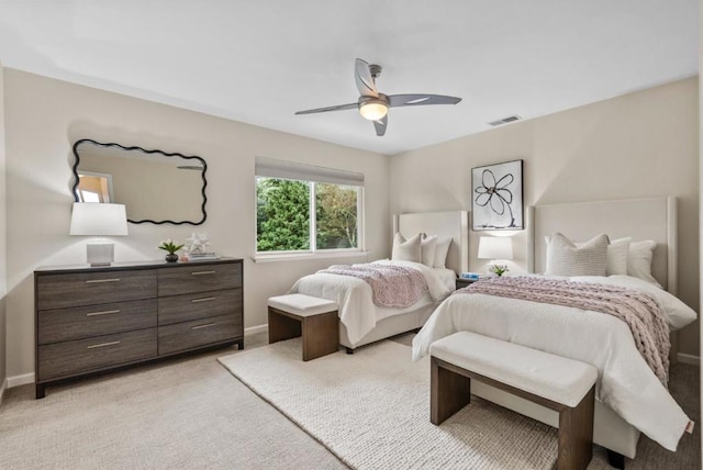 bedroom with ceiling fan and light colored carpet