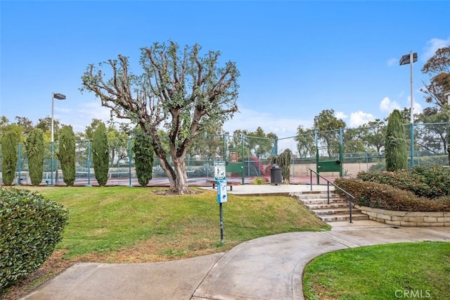 view of property's community featuring a lawn