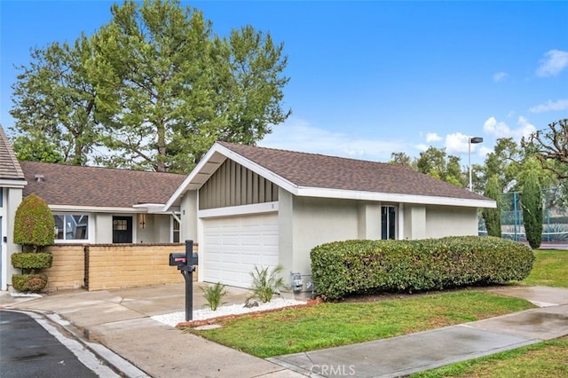 single story home with a garage