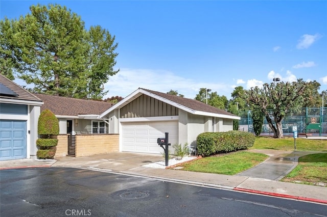 ranch-style home featuring a garage