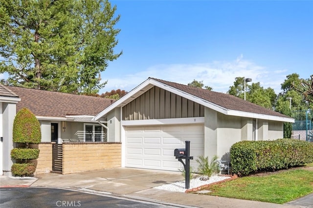 ranch-style home featuring a garage