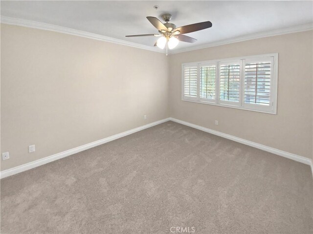 unfurnished room featuring crown molding, carpet floors, and ceiling fan