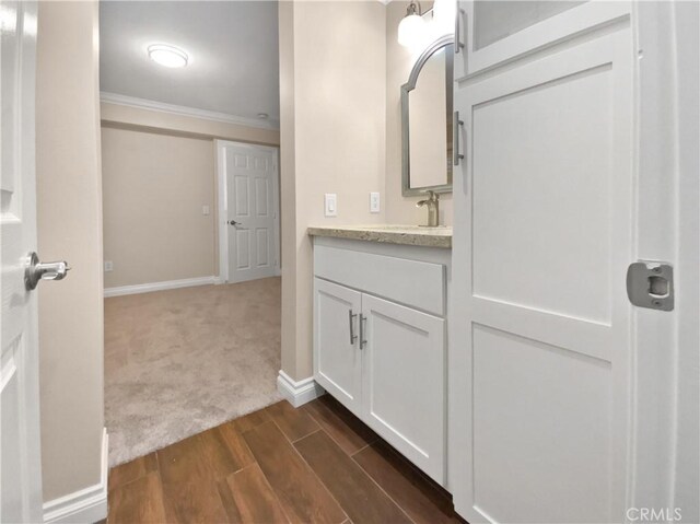 bathroom with vanity and crown molding