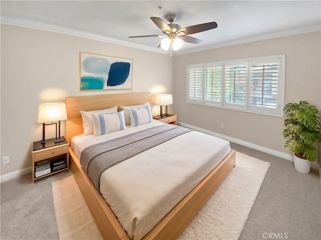 bedroom with crown molding, ceiling fan, and carpet