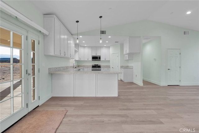 kitchen with sink, kitchen peninsula, white cabinets, and appliances with stainless steel finishes