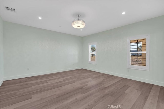 spare room with light wood-type flooring