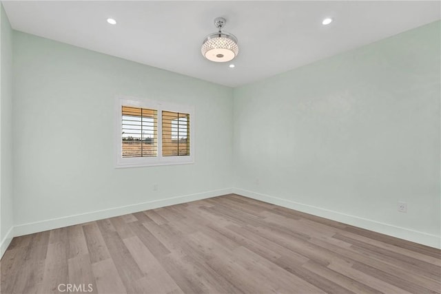 unfurnished room featuring light wood-type flooring