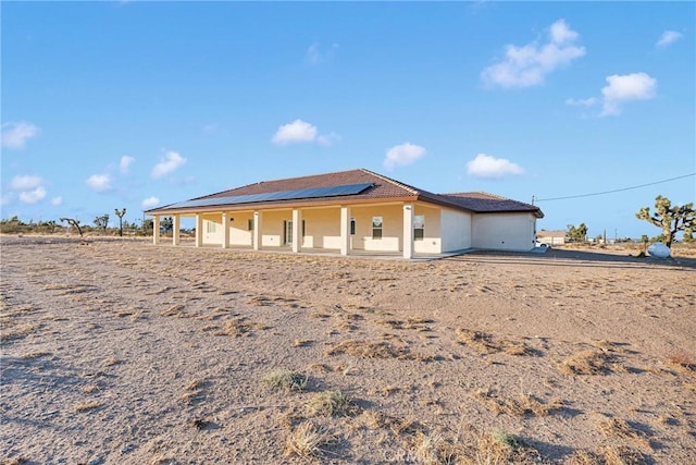 view of front of house with solar panels